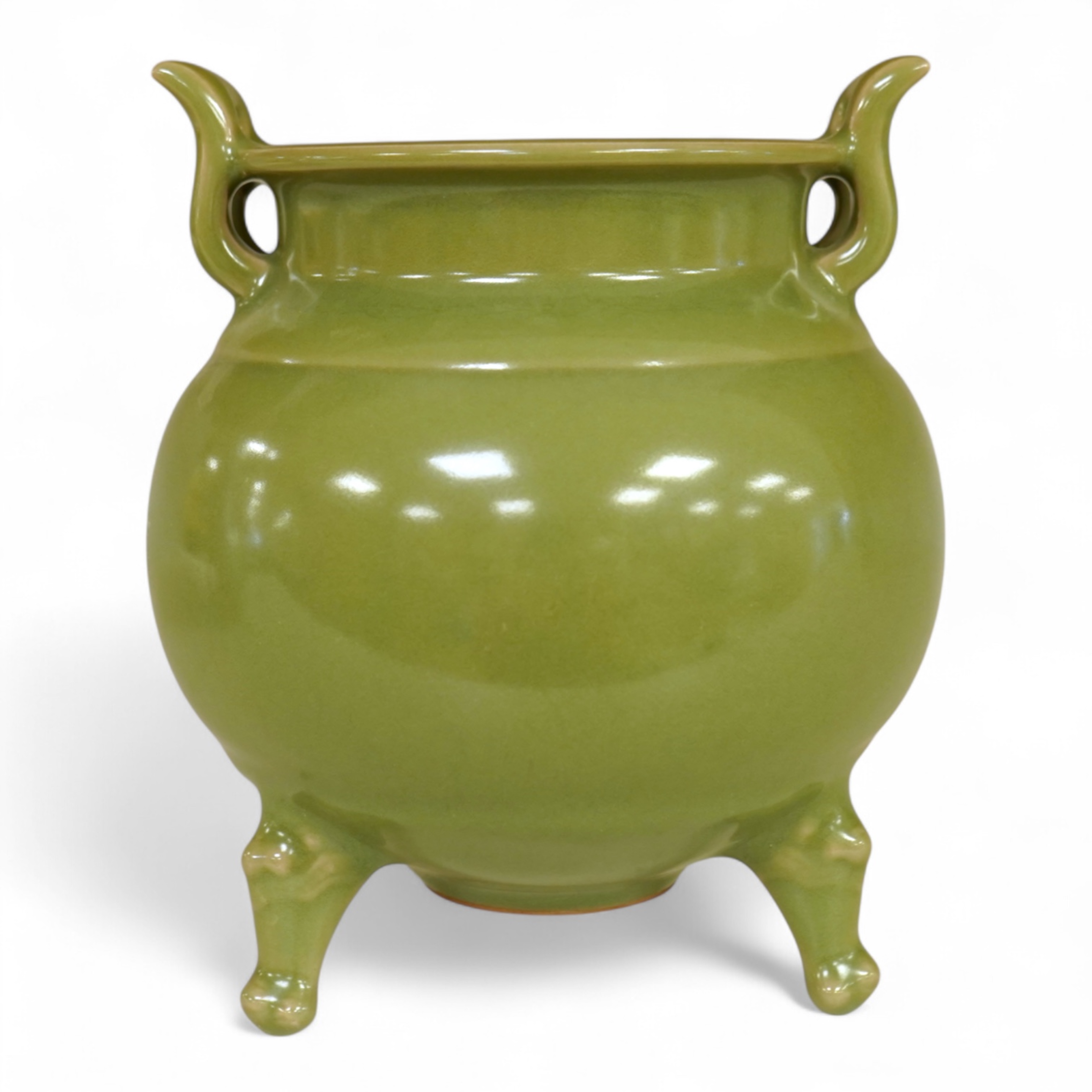 A Chinese green glazed censor on tripod feet, 16cm high